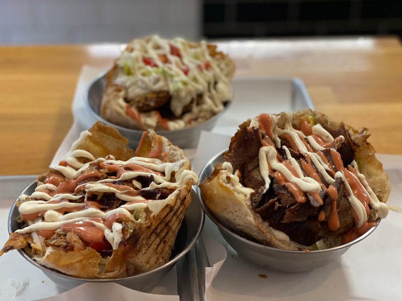 Berliner takeaway: the toasted sourdough puff for the Berliner is filled like a bowl, layered with chicken, salad, a mix of fried aubergine, bell pepper, courgette and carrot, and laced with sauces.