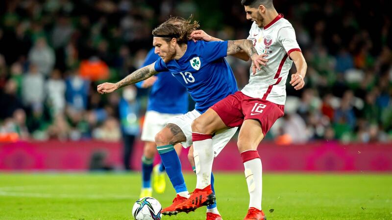 Ireland’s Jeff Hendrick holds off the challenge of Qatar’s  Karim Boudiaf at the Aviva Stadium. Photograph:  Morgan Treacy/Inpho