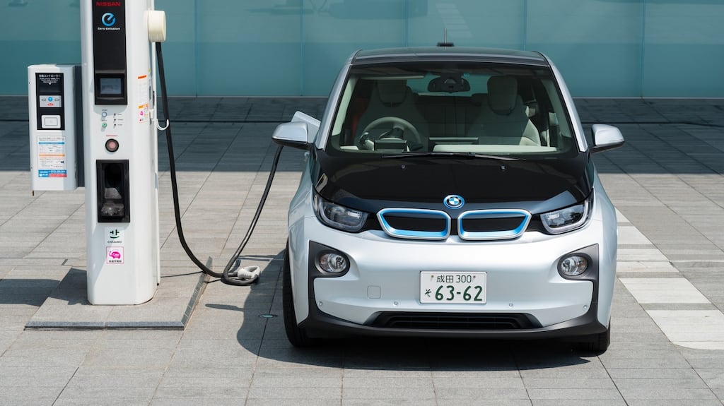 BMW’s electric car, BMW i3,  being charged at the charging station in front of the entrance of Nissan’s Global Headquarters  in Yokohama, Japan