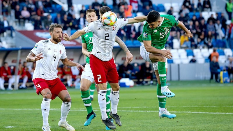 John Egan heads towards goal early on. Photo: Tommy Dickson/Inpho