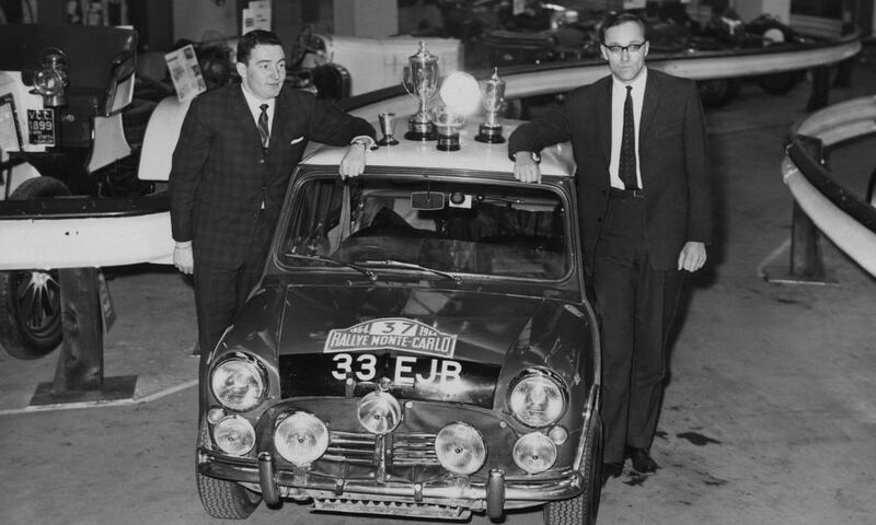 Paddy Hopkirk with navigator Henry Liddon at Olympia in London in 1964, showing off the Mini Cooper in which they had just won the Monte Carlo Rally. Photograph: Keystone/Getty Images