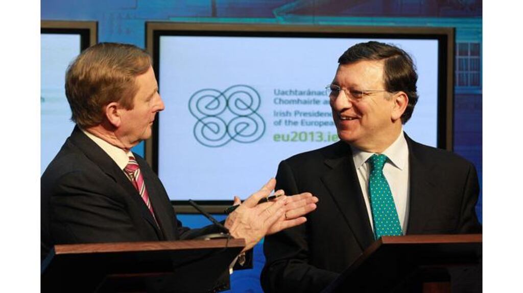 Taoiseach Enda Kenny applauds European Commission president Jose Manuel Barroso after he spoke a few words of Irish at the Government Press Centre in Dublin this afternoon. Photograph: Julien Behal/PA Wire