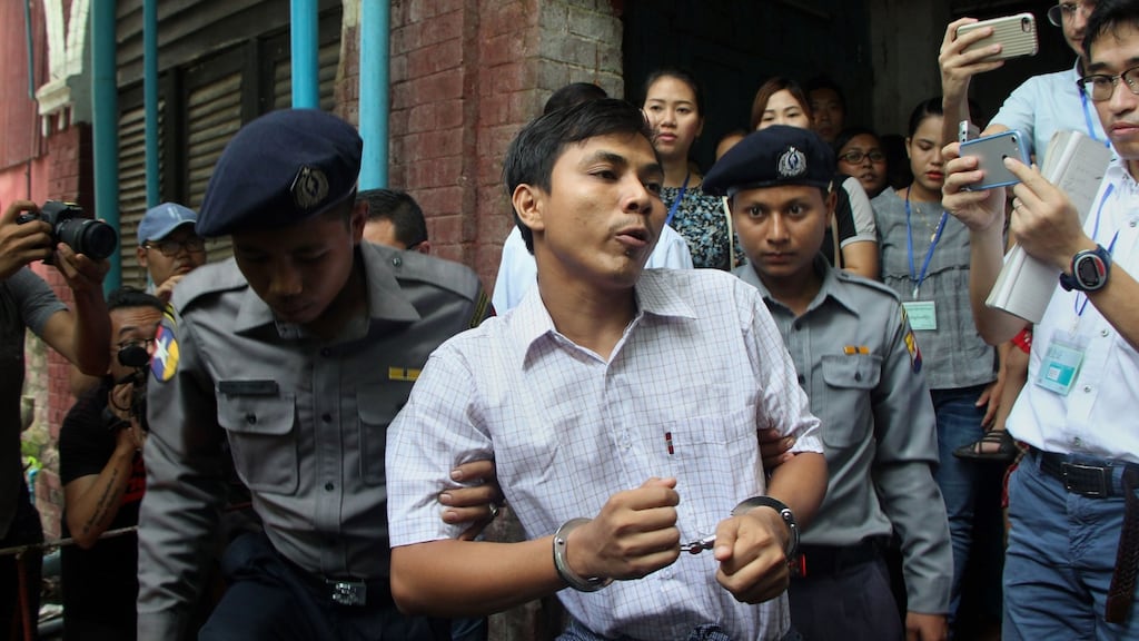 Detained Myanmar journalist Kyaw Soe Oo is escorted by police to a court in Yangon on Wednesday. Photograph: Myo Kyaw Soe/AFP/Getty Images