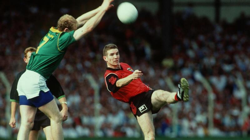 Down’s Ross Carr attempts a point as Meath’s Martin O’Connell closes in during the 1991 All-Ireland SFC Final. Photograph:  Lorraine O’Sullivan/Inpho