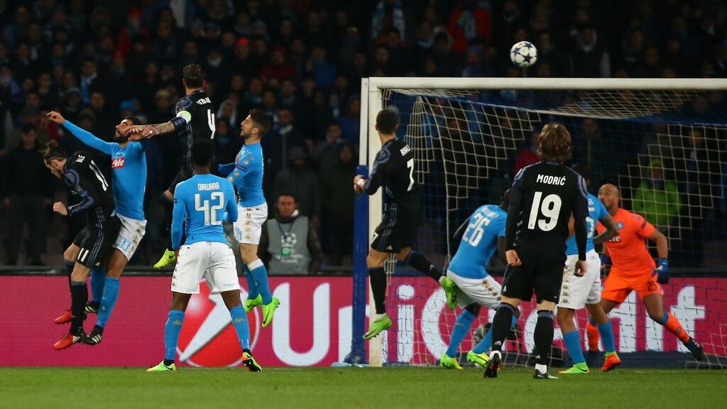 Real Madrid’s Sergio Ramos rises to score their first goal against Napoli in the Champions League last 16 second leg clash. Photo: Alessandro Bianchi/Reuters