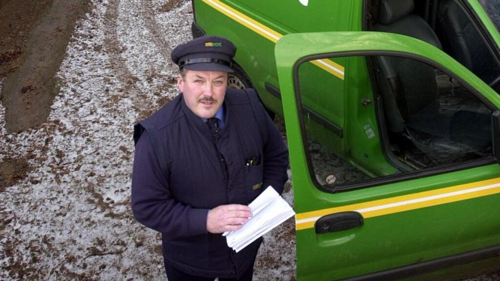 Wicklow postman Tom Gethings  delivering mail. Staffing numbers at An Post were paired back by 349 last year, bringing the reduction to 1,284 since 2009. Photograph: Eric Luke
