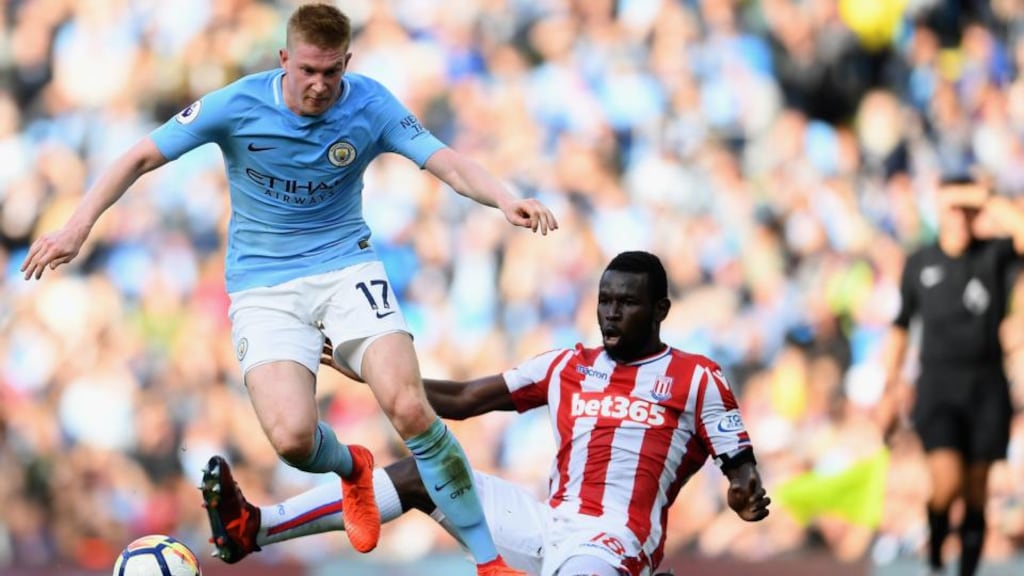 Kevin De Bruyne of Manchester City in action against Mame Biram Diouf of Stoke City during the Premier League match at Etihad Stadium. Photograph: Laurence Griffiths/Getty Images