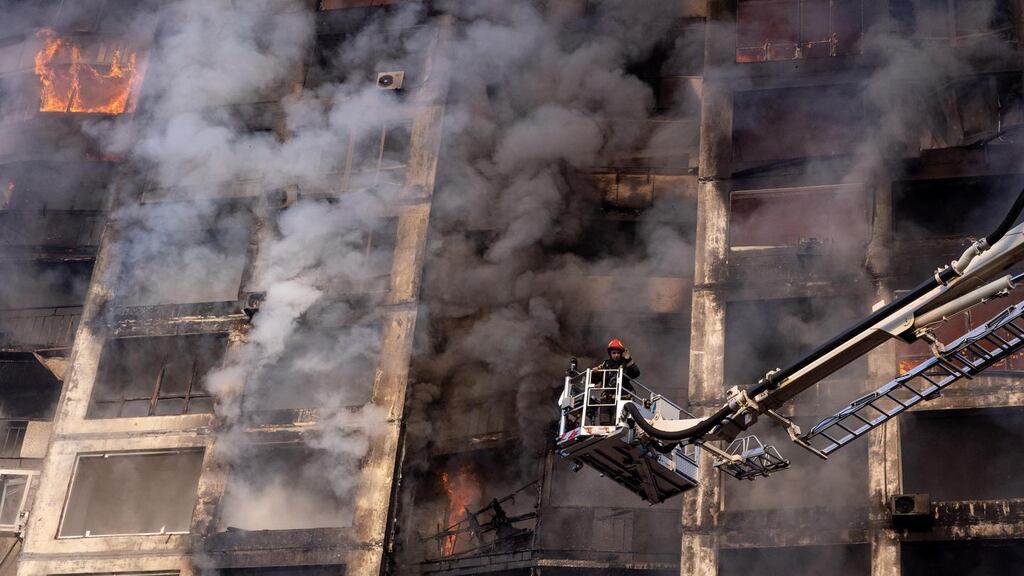 Firefighters  at a residential apartment building in Kyiv after it was hit by a Russian attack. Photograph: Chris McGrath/Getty Images