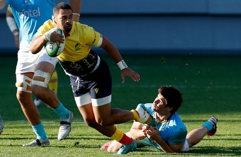 Romania's Hinckley Vaovasa is tackled by Uruguay's Tomas Inciarte during the World Rugby match between Romania and Uruguay in Bucharest, Romania, in November 2022. Uruguay won 21-16.