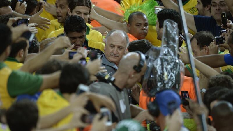 Brazil’s coach Luiz Felipe Scolari and the players climb to the podium to receive their gold medal at the end of the FIFA Confederations Cup Brazil 2013 football tournament, at the Maracana Stadium in Rio de Janeiro inJune last year. Photograph: Lluis Gene/AFP