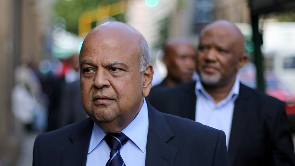 Pravin Gordhan: South Africa’s finance minister and his deputy, Mcebisi Jonas, head into to a court hearing in Pretoria. Photograph: Siphiwe Sibeko/Reuters
