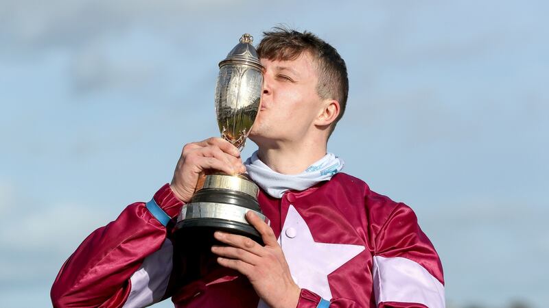 Shane Fitzgerald’s celebrates with the trophy after his win on Assemble in the Guinness Kerry National Handicap Chase in Listowel. Photograph: Bryan Keane/Inpho