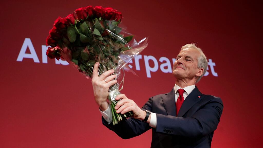 Labour leader Jonas Gahr Stoere holds a bouquet of red roses at the Labour Party’s election event in Oslo on Monday night. Photograph:  Javad Parsa/NTB via AP