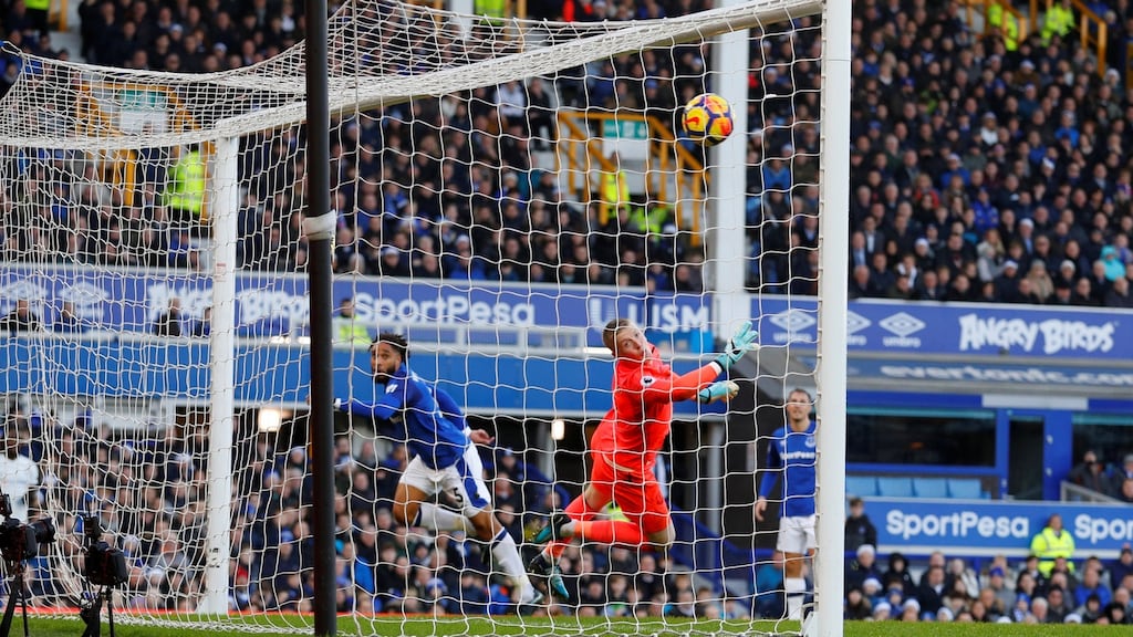 Everton’s Ashley Williams heads against his own bar as goalkeeper Jordan Pickford during the Premier League game against Chelsea at Goodison Park. Photograph: Phil Noble/Reuters
