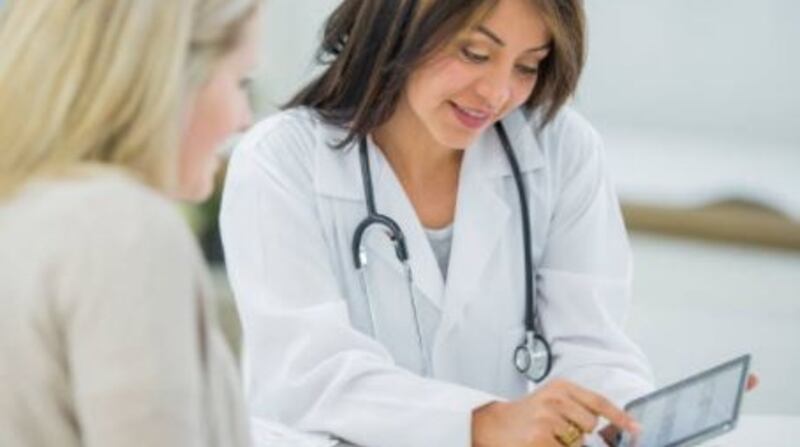 Reviewing smear test results: A decision on whether  US companies will continue to be contracted by the HSE will not be made until after the Government’s inquiry is completed. File photograph: Getty Images