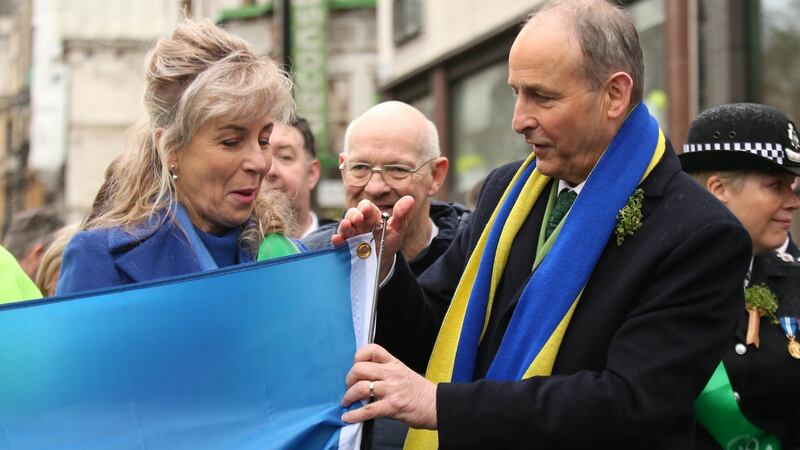 Taoiseach Micheál Martin with London-based Ukrainian Natalia Lesyuk (left) during the St Patrick’s Day parade in London. Photograph: James Manning/PA Wire
