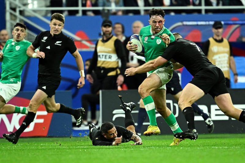 Ireland's fullback Hugo Keenan is tackled by New Zealand's openside flanker and captain Sam Cane during the Rugby World Cup quarter-final in Saint-Denis, Paris. Photograph: Julien De Rosa/AFP via Getty Images