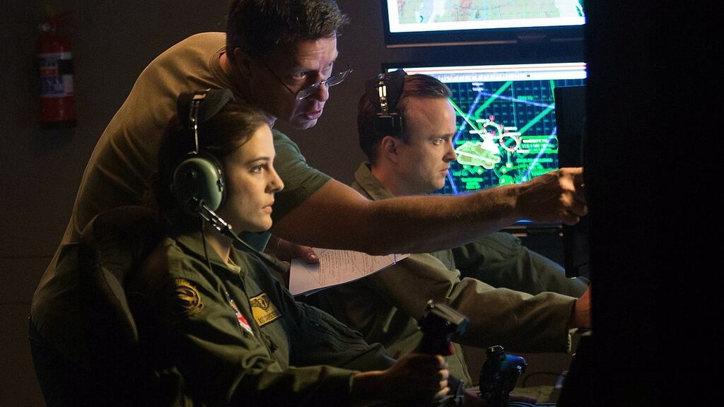 Bang on target: Director Gavin Hood with Phoebe Foxand Aaron Paul on the set of Eye in the Sky