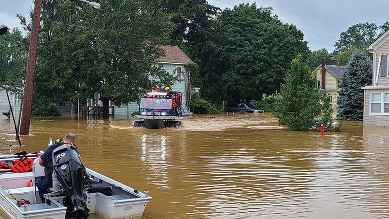 Emergency services and first responders assist residents who need help after heavy rains from Henri flooded parts of Helmetta, New Jersey on Sunday. Photograph: Chris Slavicek via AP