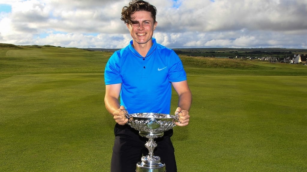 Conor Purcell of Portmarnock with the trophy after winning the South of Ireland Amateur Championship at Lahinch Golf Club. Photograph: Thos Caffrey/Golffile.