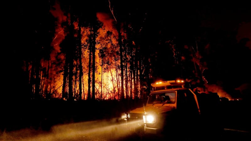 Fire crews monitor fires and begin back burns between the towns of Orbost and Lakes Entrance in east Gipplsland on January 2nd, 2020 in Australia. Photograph: Traynor/Getty Images