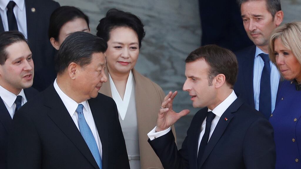 French president Emmanuel Macron talks with Chinese president Xi Jinping at the Élysée Palace in Paris. Photograph: Thibault Camus/Pool via Reuters