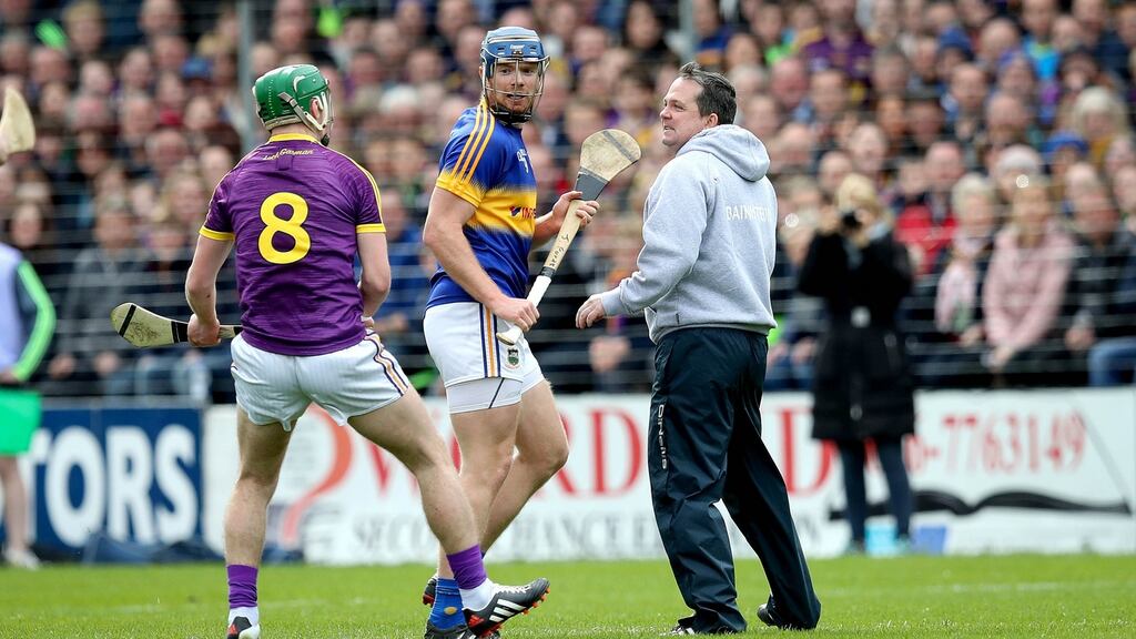 Wexford’s Aidan Nolan and manager Davy Fitzgerald confront Tipperary’s Jason Forde during the controversial league semi-final incident at Nowlan Park. Photograph: Ryan Byrne/Inpho