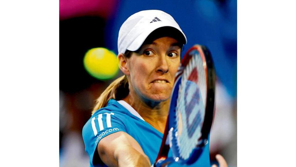 Belgium's Justine Henin returns a shot against compatriot Yanina Wickmayer at the Australian Open in Melbourne yesterday.