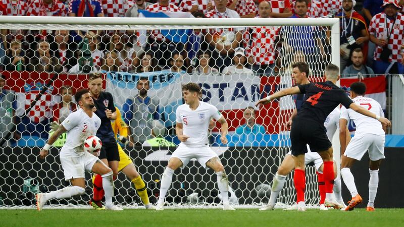 England’s Kyle Walker’s concentration may have been affected by blocking Ivan Perisic’s shot. Photograph: Kai Pfaffenbach/Reuters