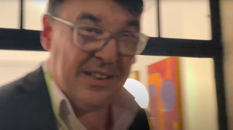 A handout photo issued by the Crown Prosecution Service of a screengrab from a video played to the court appearing to show Graham Linehan grabbing the complainant's phone. Photograph: CPS/PA Wire