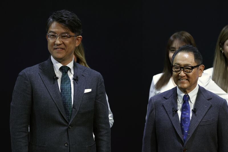 Koji Sato (left) with Akio Toyoda. Photo: Kiyoshi Ota/Bloomberg