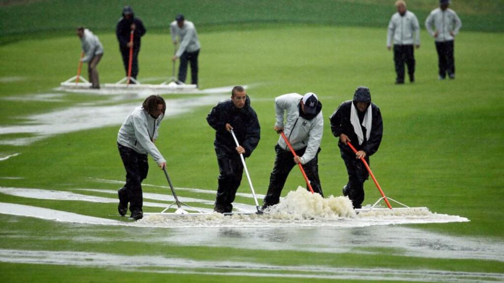 Greenkeepers  push water off the first fairway during the second round of the PGA Championship  at Valhalla GC  in Louisville. Photograph: Jeff Roberson/AP