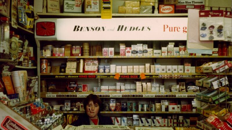 Catherine as a child in detective mode behind the counter of her dad’s shop.