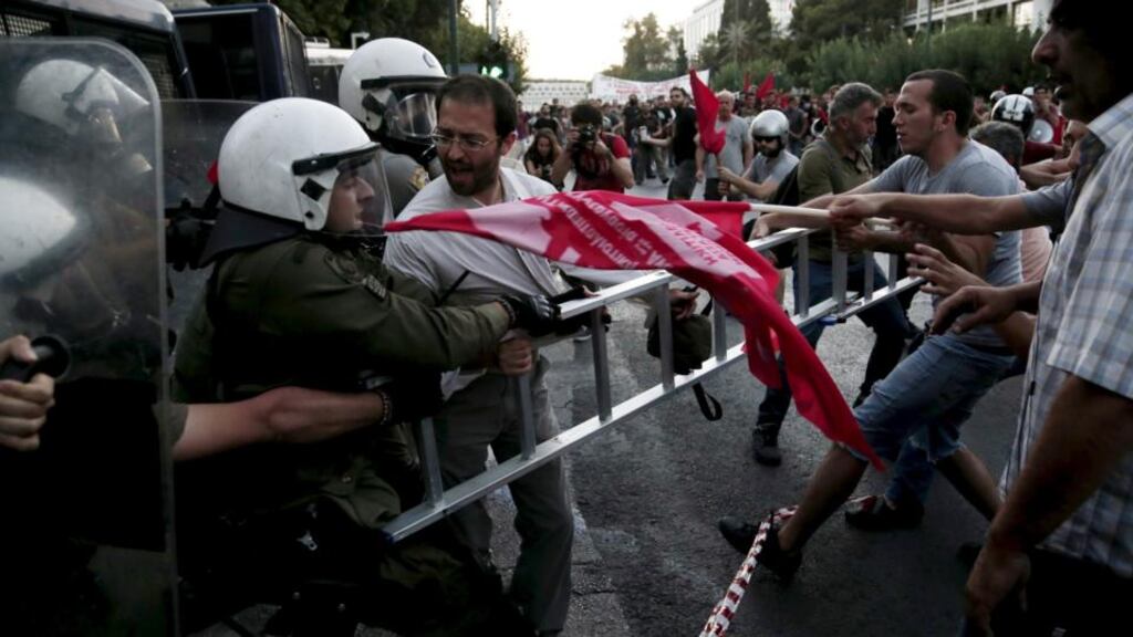 Anti-Euro protesters scuffle with riot police at the European Union representation offices in Athens, Greece, July 2nd, 2015. Photograph: Panayiotis Tzamaros/Reuters