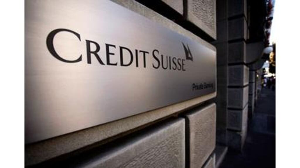 Credit Suisse reported a fourth-quarter profit that missed estimates as it booked reorganisation costs and a charge related to its own debt.