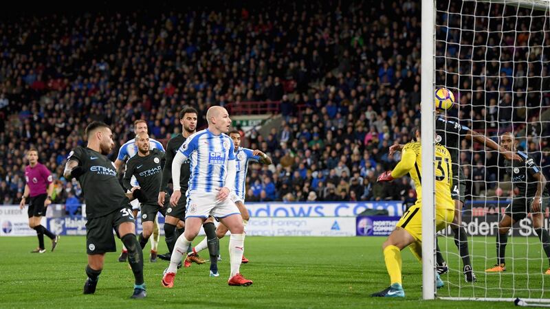 Nicolas Otamendi turns the ball into his own net against Huddersfield. Photograph: Shaun Botterill/Getty