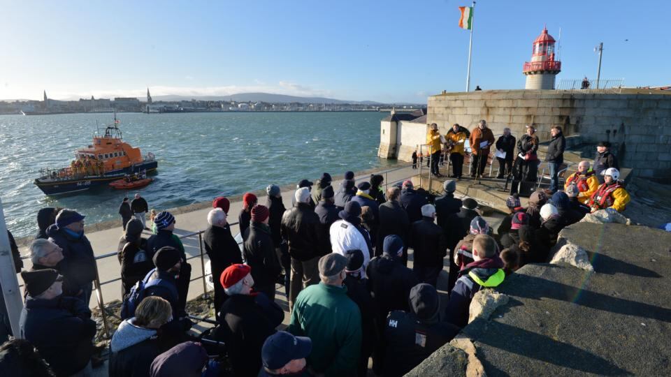 Dun Laoghaire crew members and member sof the public take part in a ceremony on the East Pier to remember the 15 volunteers that died on service in 1895 on Christmas Eve attempting to rescue those on board the SS Palme which had run aground off Blackrock. . Photograph: Alan Betson / The Irish Times