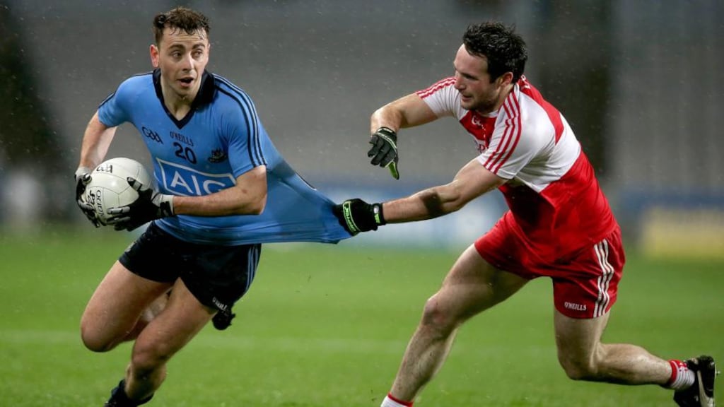 Cormac Costello of Dublin with Oisin Duffy of Derry. Photo: Donall Farmer/Inpho