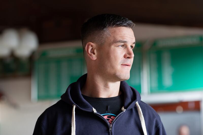 Pic: Sexton at his second home, Bective Rugby Club where his father and uncle are both listed on the green captain and president boards to the rear