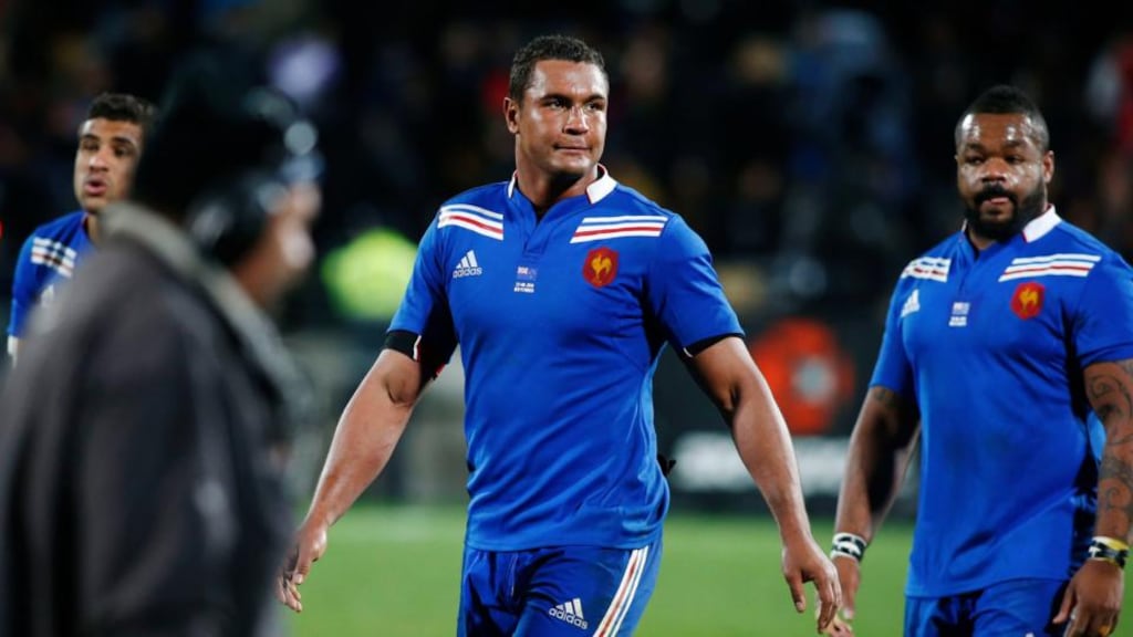 France captain Thierry Dusautoir leaves the pitch with teammate Mathieu Bastareaud. Photograph: Nigel Marple/Reuters