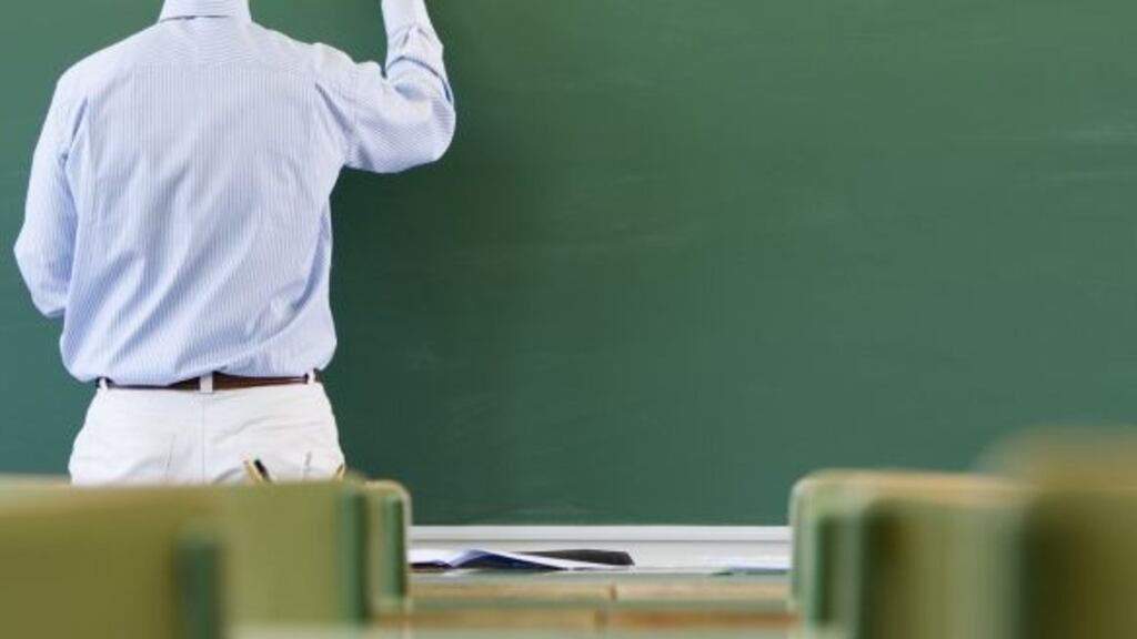 The teacher was suspended on full pay.