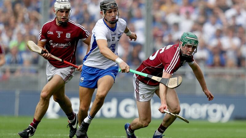 Mannion gets to the sliotar ahead of Maurice Shanahan. Photo: Tommy Dickson/Inpho