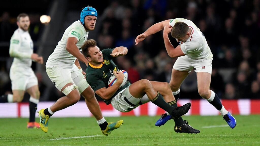 England’s Owen Farrell makes a challenge on South Africa’s Andre Esterhuizen during the international Test match at Twickenham. Photo: Toby Melville/Reuters