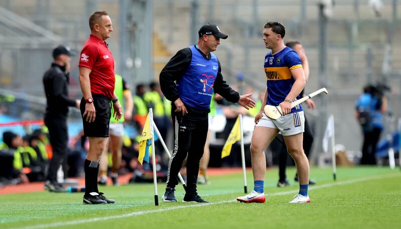 Tipperary manager Liam Cahill with Darragh McCarthy after his sending off. Photograph: Ryan Byrne/Inpho