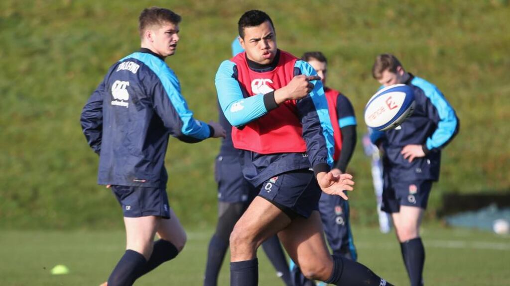 Luther Burrell passes the ball during the England training session at Pennyhill Park. Photograph: David Rogers/Getty Images