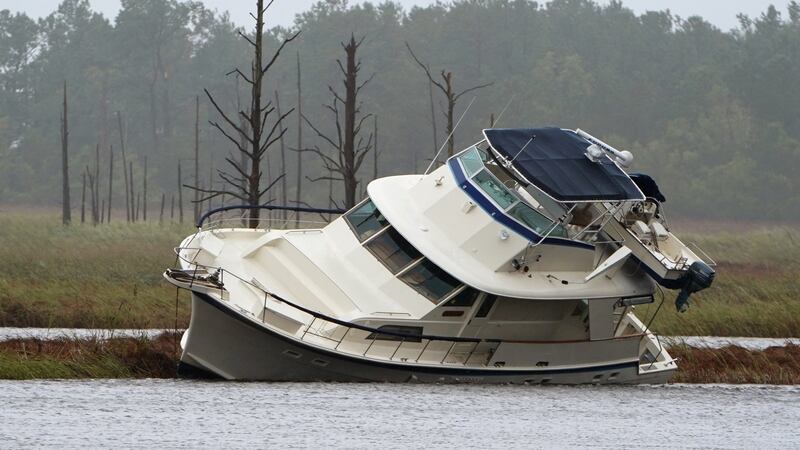 A boat that washed onto a marshy area during Hurricane Florence, in Wilmington, North Carolina. Photograph: Carlo Allegri/Reuters