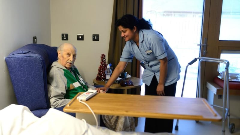 Our Lady’s Hospice: Francis Moore with nurse Nisha Alexander. Photograph: Cyril Byrne
