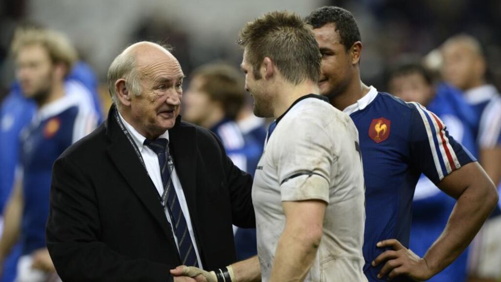 New Zealand’s All Blacks flanker and captain Richie McCaw shakes hands with French rugby federation (FFR) president Pierre Camou.