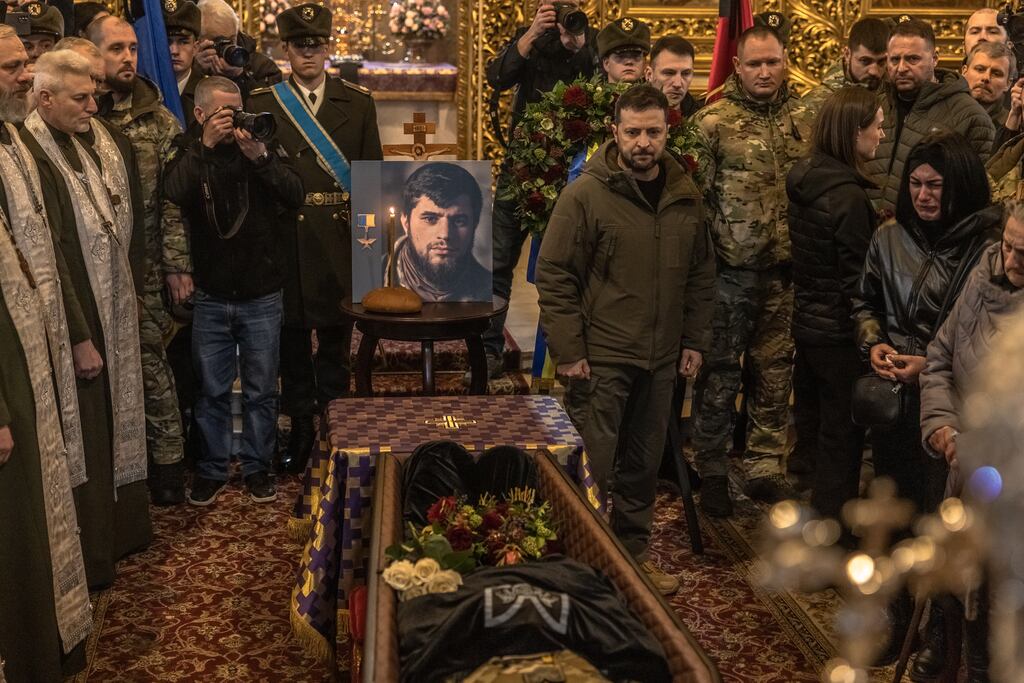 Ukrainian president Volodymyr Zelensky at the funeral of Dmytro Kotsiubailo, Praviy Sektor’s youngest battalion commander, in March. Photograph: Roman Pilipey/Getty Images