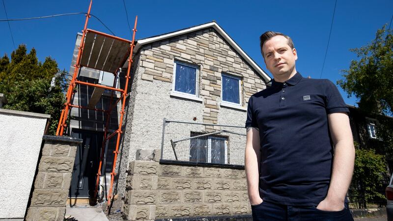 Thomas McGirr outside their home during its makeover. Photograph: Tom Honan
